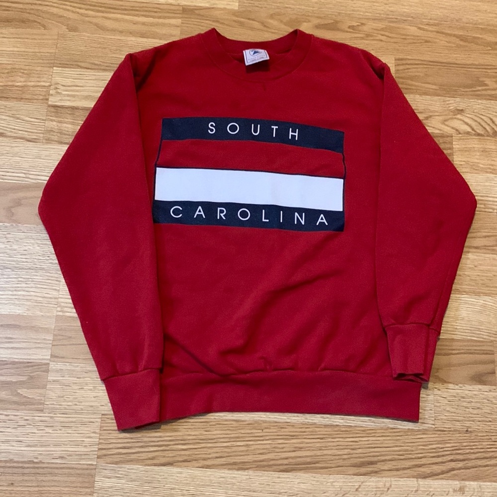 Red sweater and a M